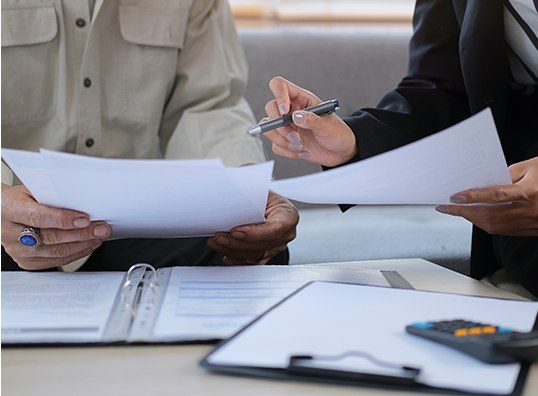 Estate planning attorney reviewing wills, trusts, and estate administration documents with clients in Pennsylvania